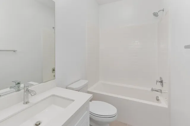 a bathroom with a sink toilet and bathtub