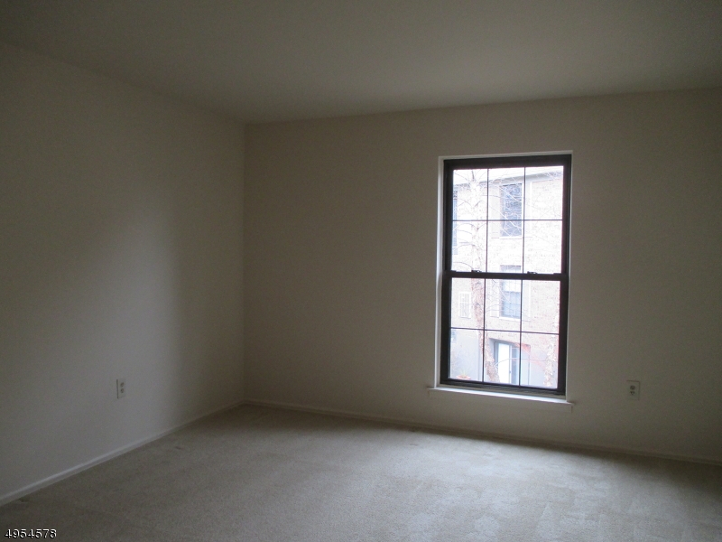 181 Long Hill Road, Unit 6 Little Falls, NJ 07424 - Photo 11 of 20 an empty room with a window