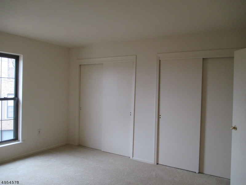 181 Long Hill Road, Unit 6 Little Falls, NJ 07424 - Photo 12 of 20 a view of an empty room with a window