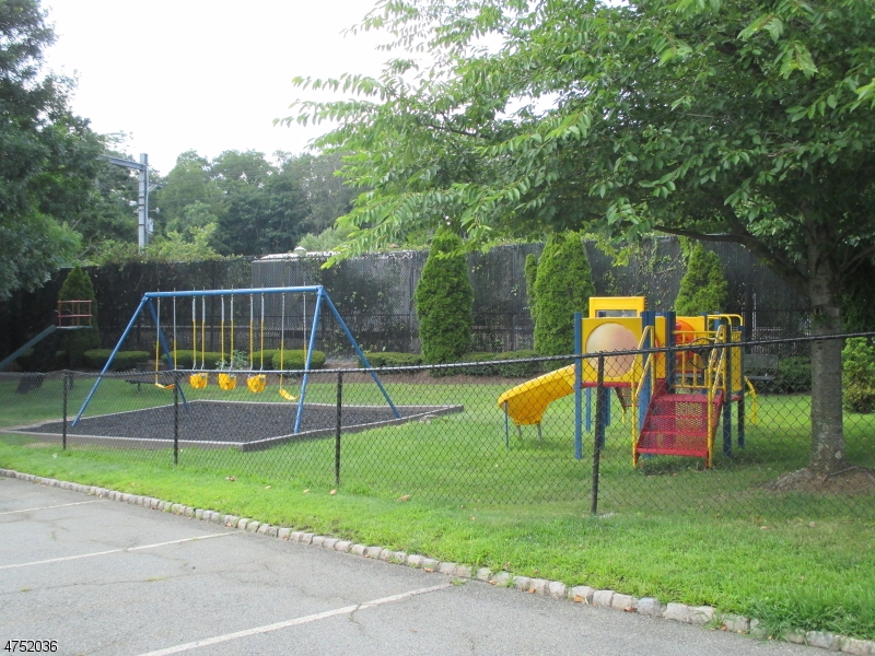 181 Long Hill Road, Unit 6 Little Falls, NJ 07424 - Photo 17 of 20 a view of a park with swings