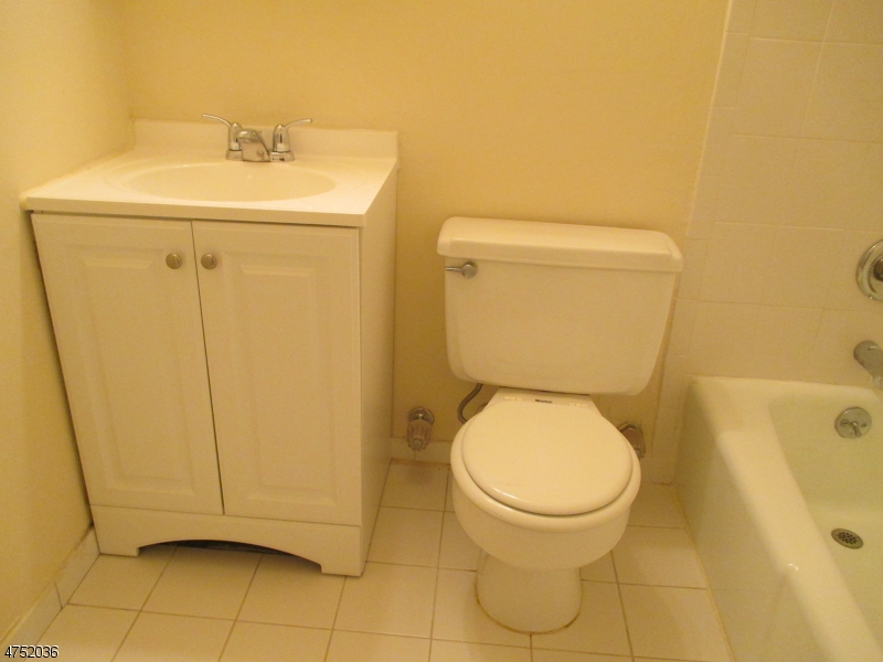 181 Long Hill Road, Unit 6 Little Falls, NJ 07424 - Photo 10 of 20 a bathroom with a toilet and a sink