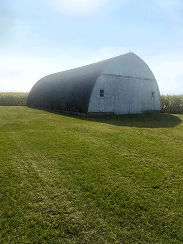 a kitchen with stainless steel appliances granite countertop a sink a stove and a microwave oven