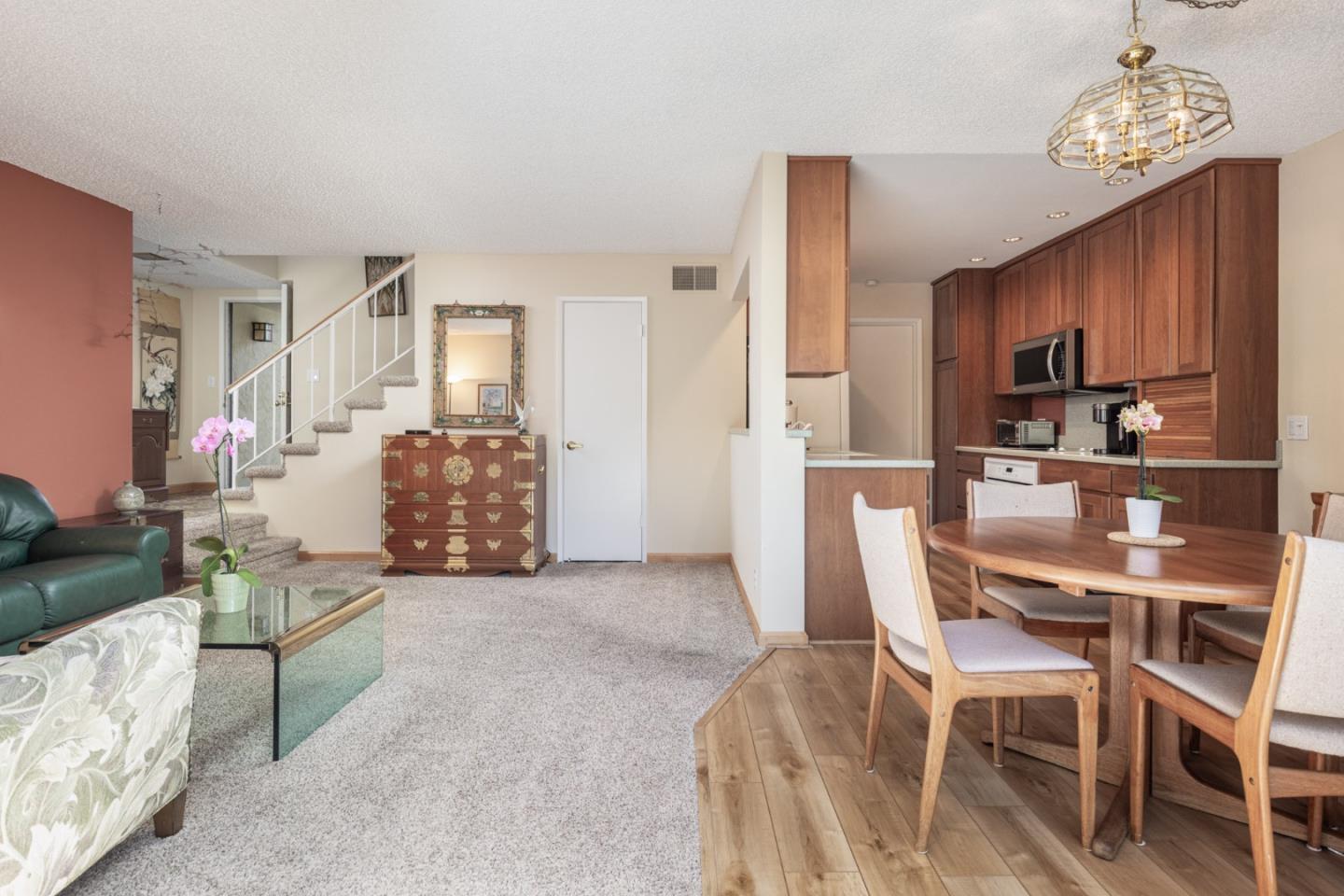 1360 Josselyn Canyon Road, Unit 40 Monterey, CA 93940 - Photo 2 of 18 a view of a dining room with furniture and a chandelier