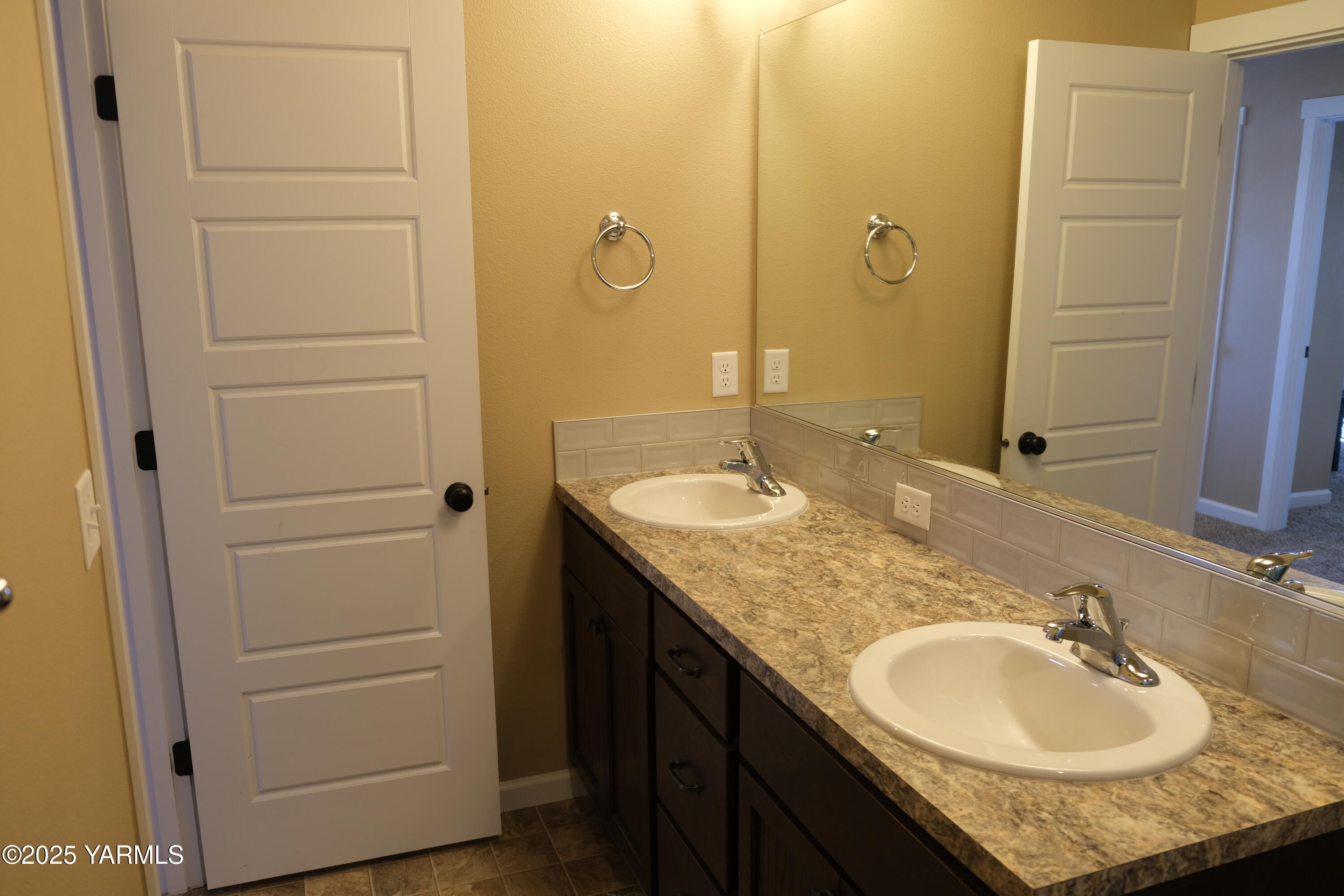 2206 Porter Loop Yakima, WA 98901 - Photo 24 of 34 a bathroom with a granite countertop sink and a mirror