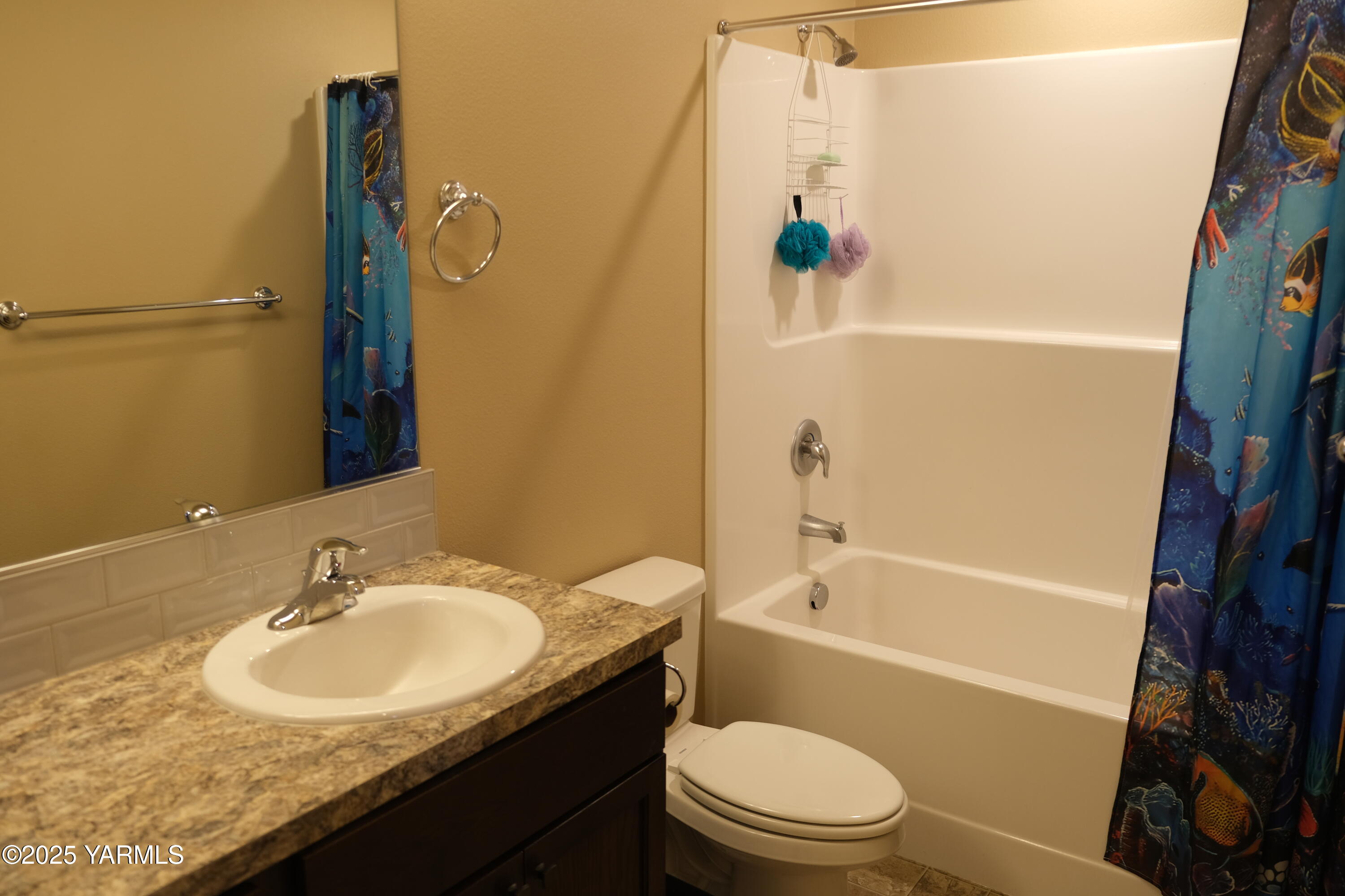 2206 Porter Loop Yakima, WA 98901 - Photo 25 of 34 a bathroom with a granite countertop sink toilet and shower