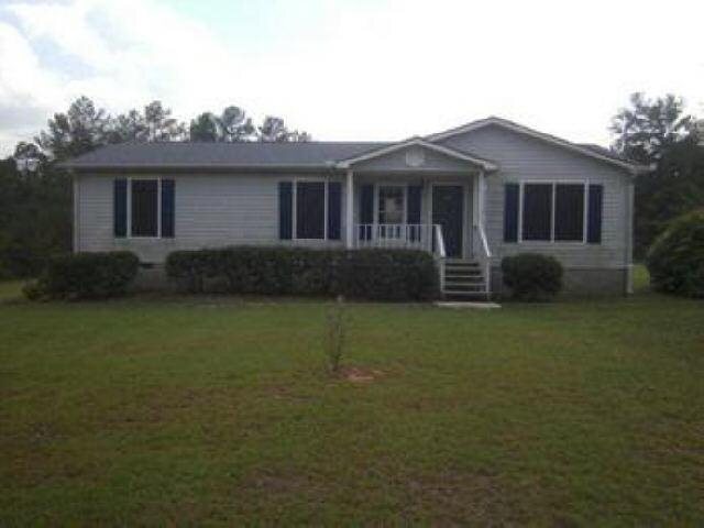 7635 Hannah Road Winston, GA 30187 - Photo 1 of 1 a front view of house with garden