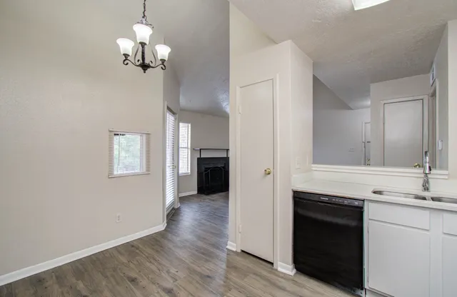 a view of a kitchen cabinets and wooden floor