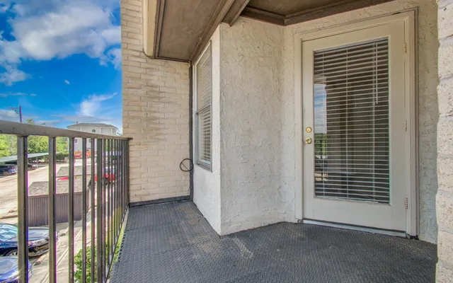 a view of a porch with a door