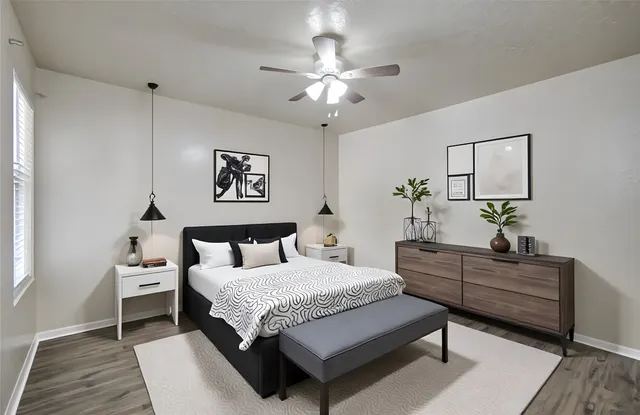 a bedroom with a bed and a table