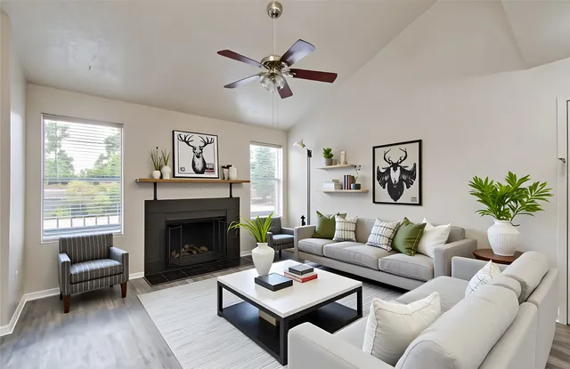 a living room with furniture and a fireplace