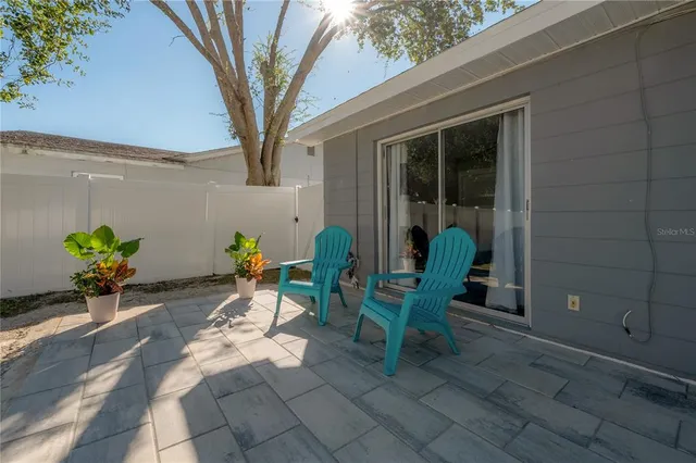 a view of a room with table and chairs