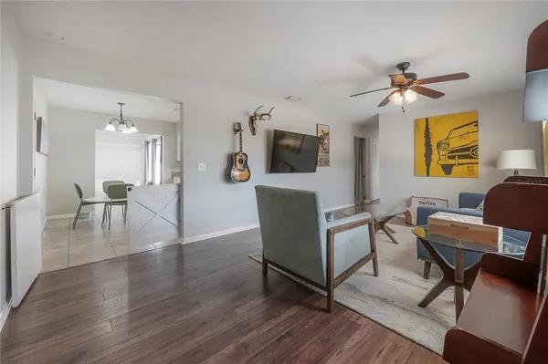 a work room with furniture and a flat screen tv