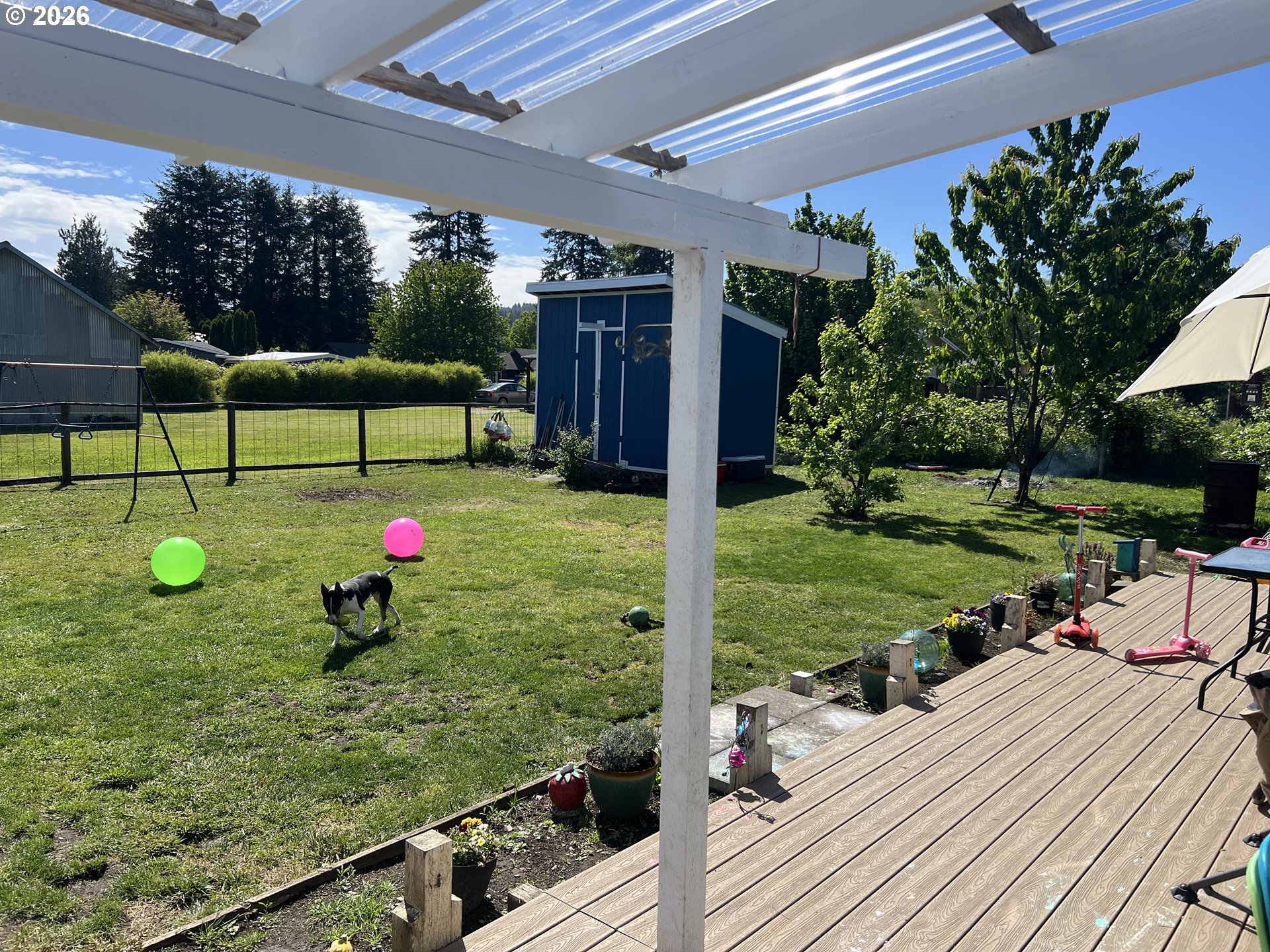 210 Northwest Grinstead Street Siletz, OR 97380 - Photo 27 of 29 a view of a backyard with sitting area and tree