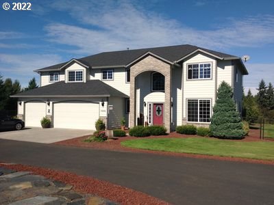 5606 Northwest 280th Street Ridgefield, WA 98642 - Photo 1 of 32 a front view of a house with a yard