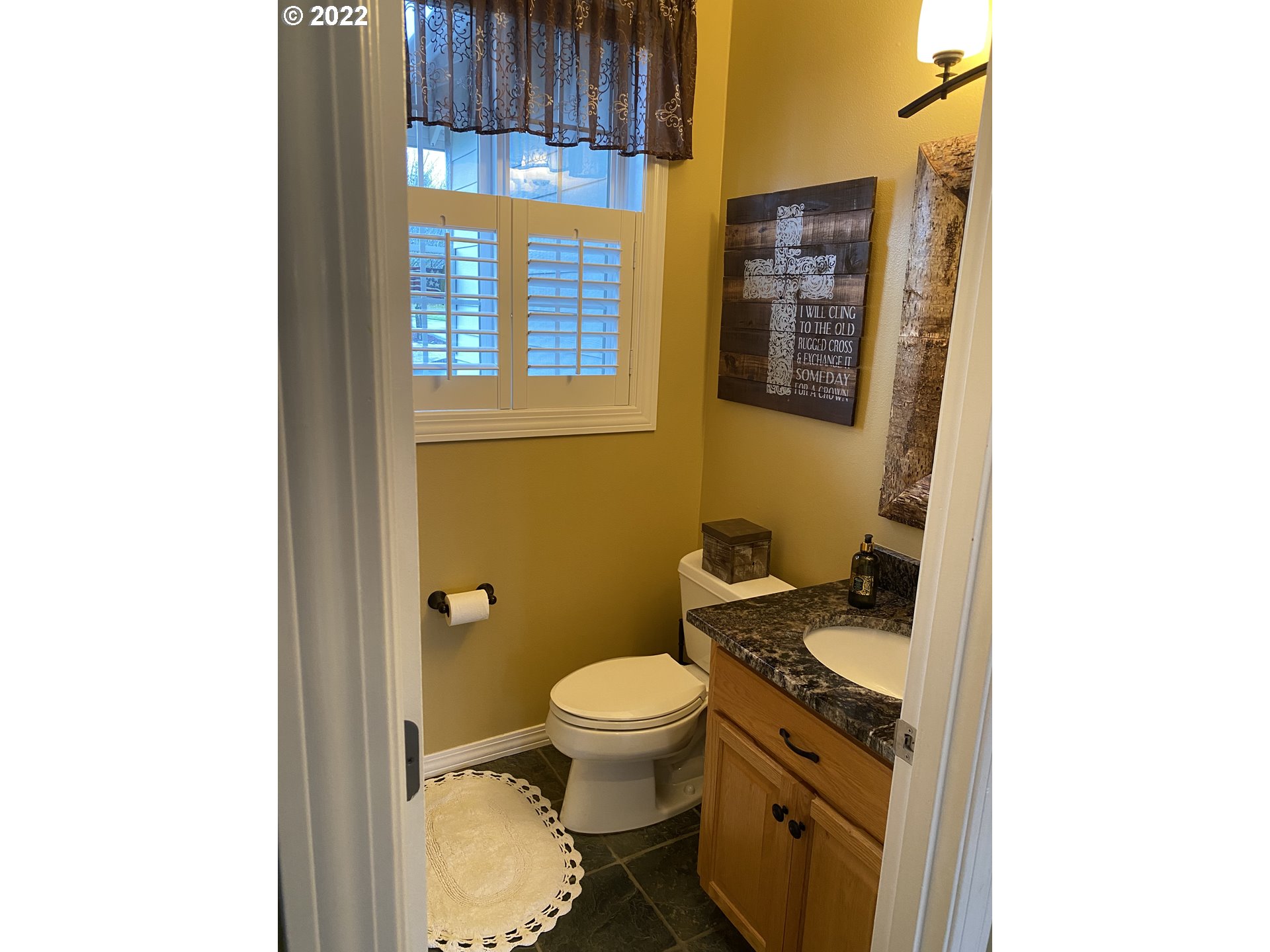 5606 Northwest 280th Street Ridgefield, WA 98642 - Photo 13 of 32 a bathroom with a granite countertop toilet and a sink