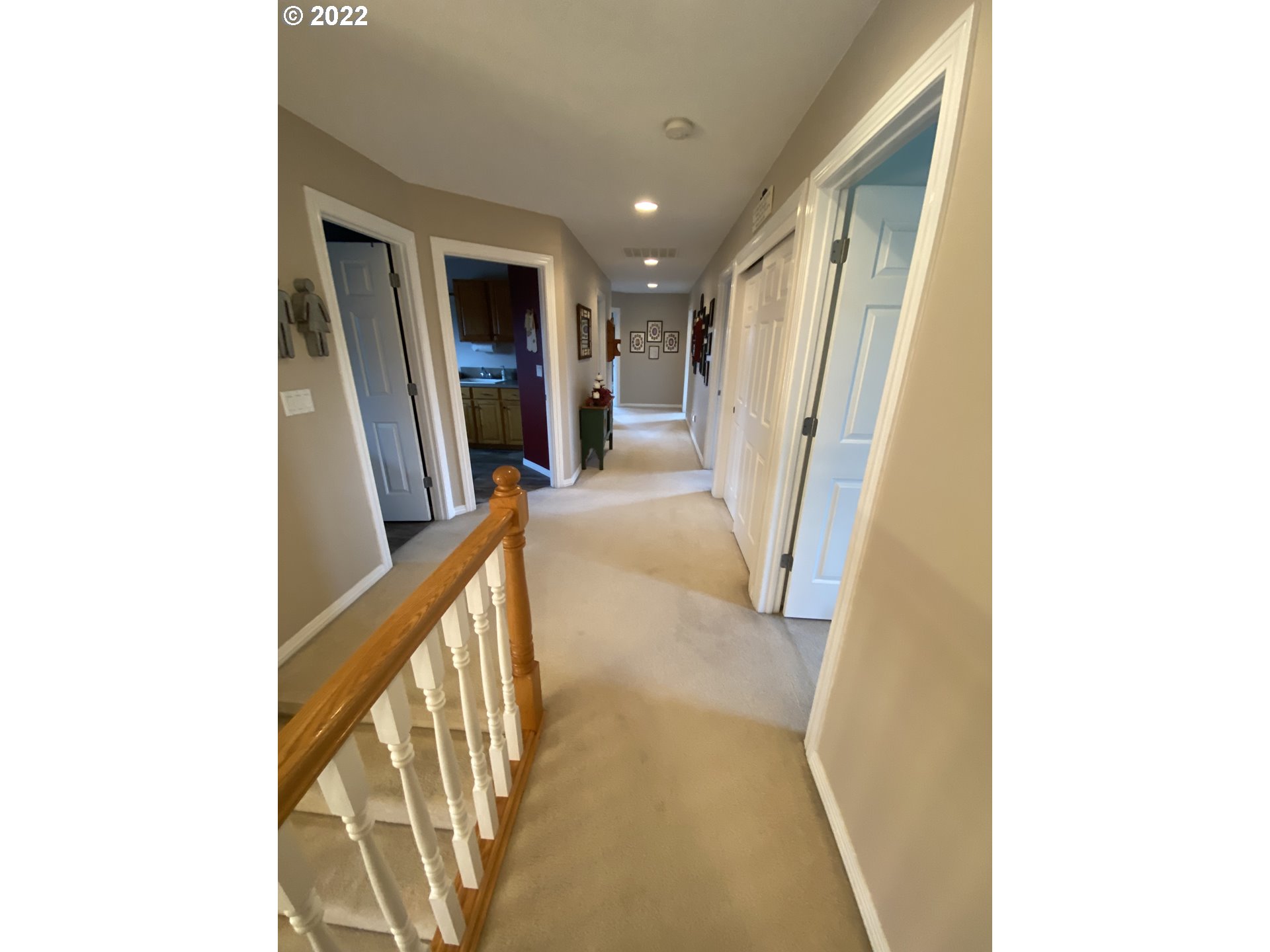5606 Northwest 280th Street Ridgefield, WA 98642 - Photo 16 of 32 a view of a hallway with furniture and a window