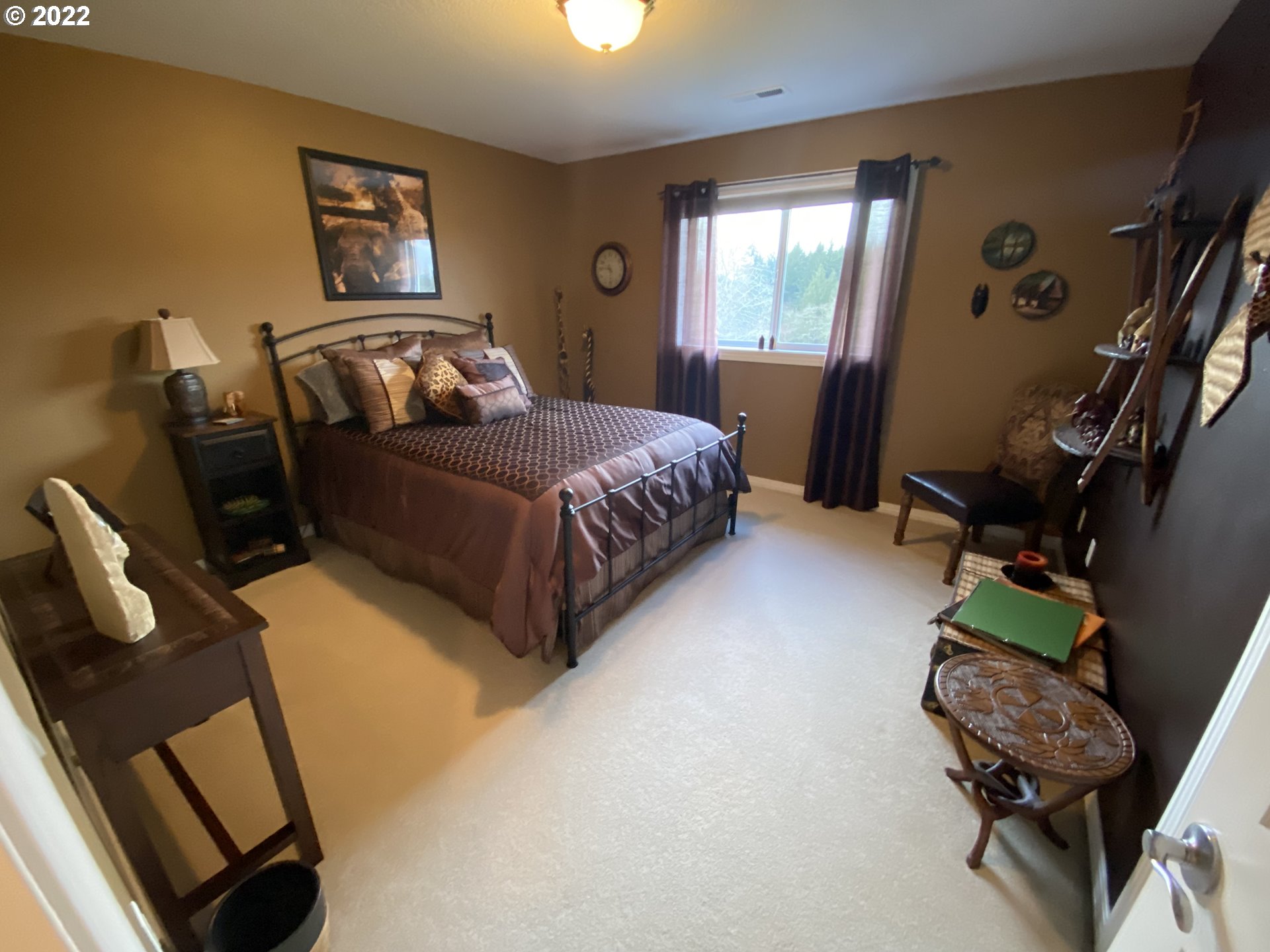 5606 Northwest 280th Street Ridgefield, WA 98642 - Photo 20 of 32 a bedroom with furniture and a window