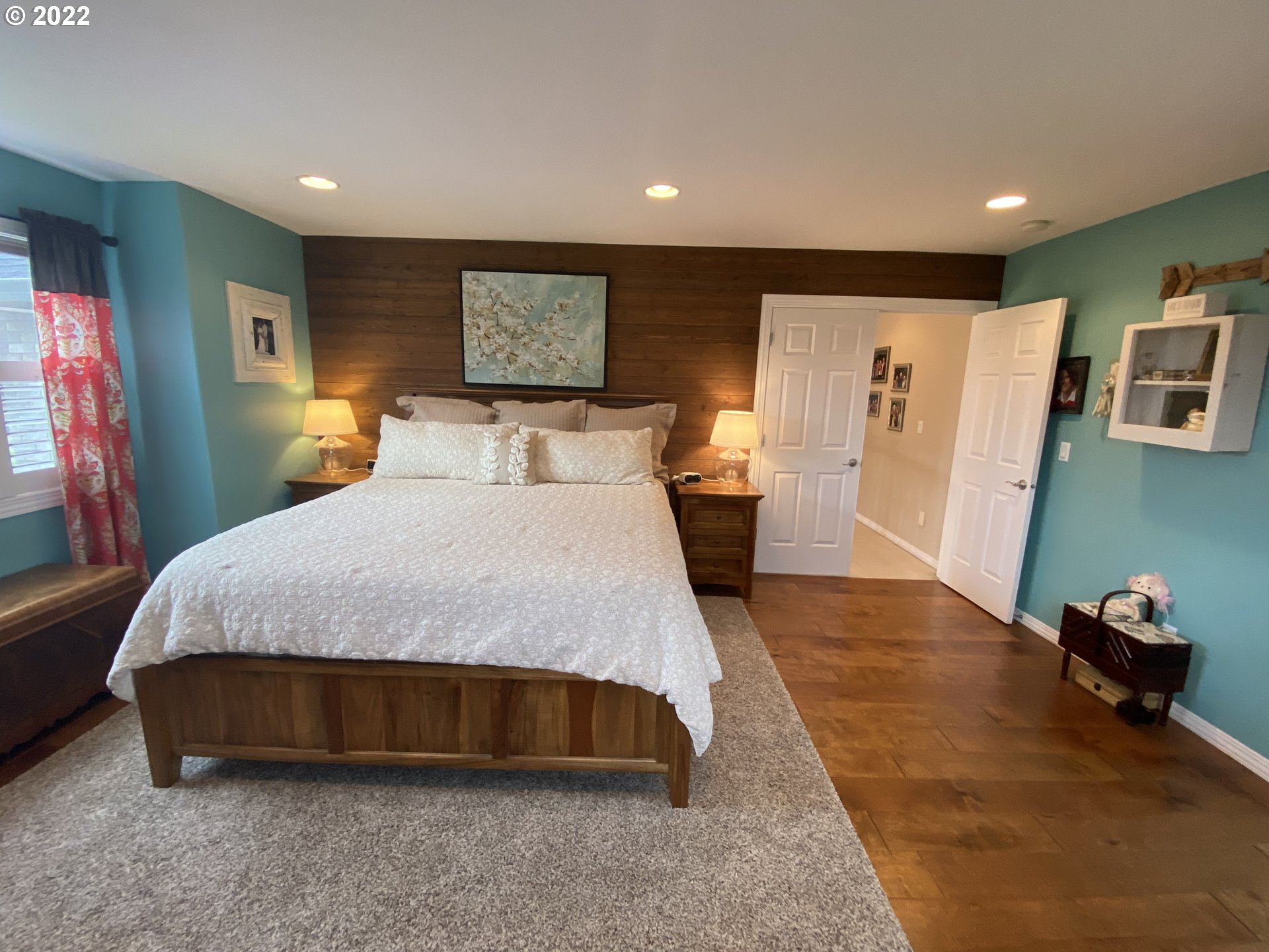 5606 Northwest 280th Street Ridgefield, WA 98642 - Photo 22 of 32 a spacious bedroom with a bed and a couch