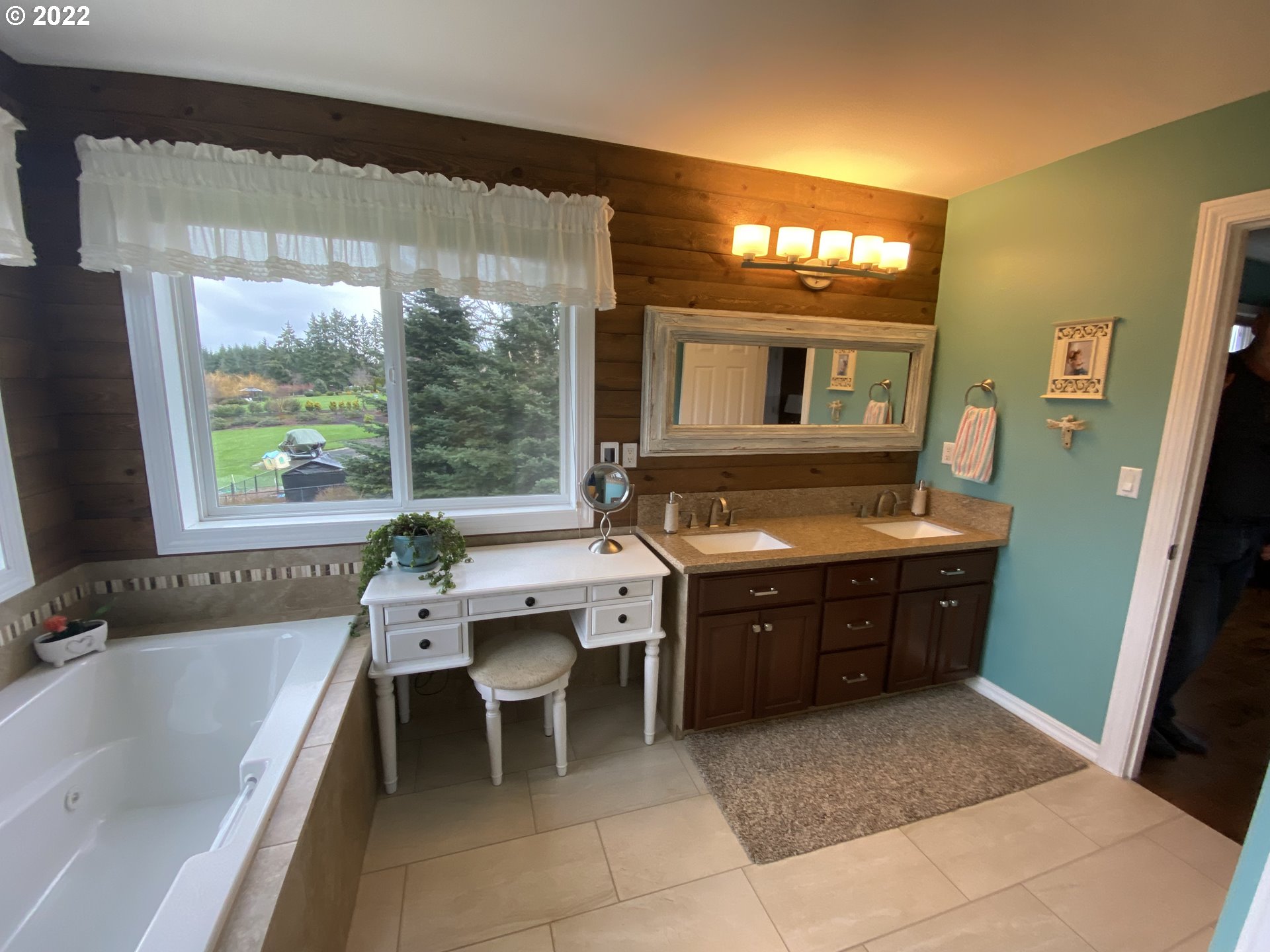 5606 Northwest 280th Street Ridgefield, WA 98642 - Photo 23 of 32 a spacious bathroom with a tub sink and mirror