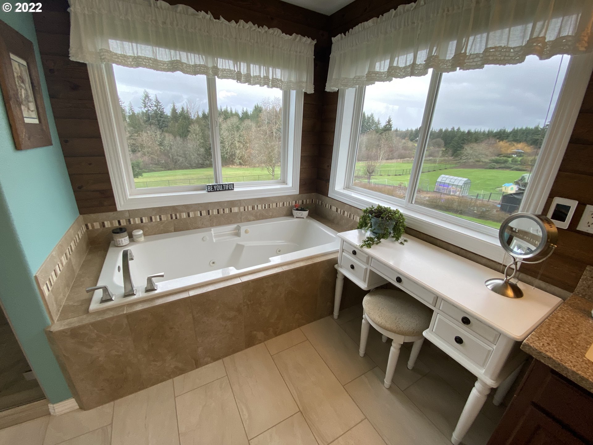 5606 Northwest 280th Street Ridgefield, WA 98642 - Photo 24 of 32 a bathroom with a bathtub and next to a window