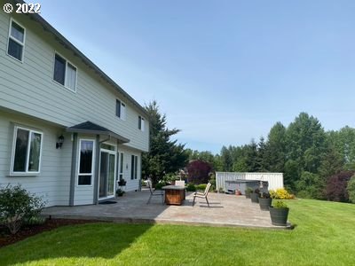 5606 Northwest 280th Street Ridgefield, WA 98642 - Photo 27 of 32 a view of a house with sitting area and garden