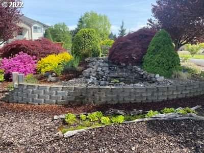 5606 Northwest 280th Street Ridgefield, WA 98642 - Photo 30 of 32 a view of a pathway with flower plants