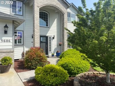 5606 Northwest 280th Street Ridgefield, WA 98642 - Photo 3 of 32 a front view of a house with garden