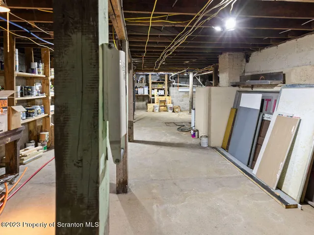 a view of a kitchen with a sink and cabinets