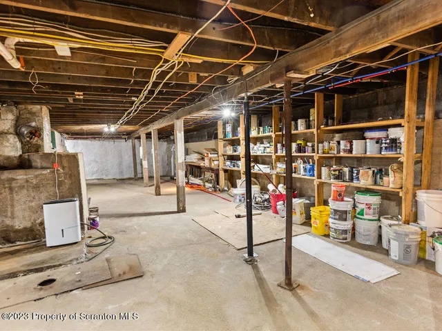 a kitchen with a stove a refrigerator and a cabinets