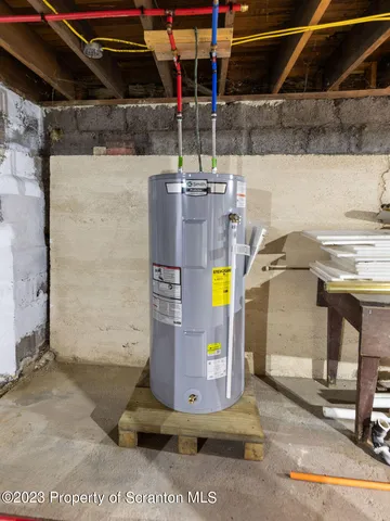 a kitchen with granite countertop a refrigerator and a stove top oven