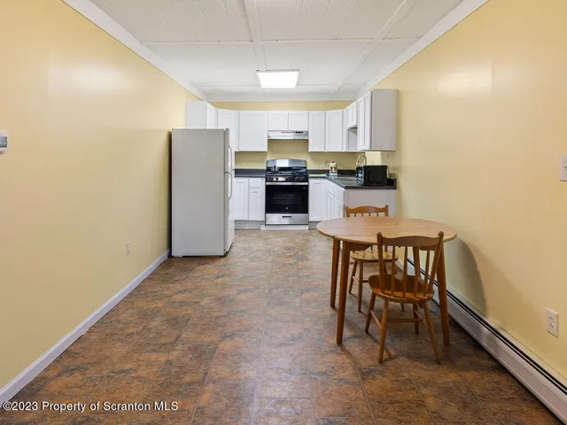 a view of a kitchen with car parked