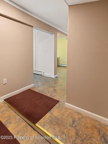 a view of a kitchen with granite countertop and chair
