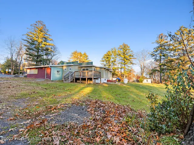 a view of a house with a big yard