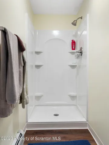 a bathroom with a toilet a sink a mirror and vanity