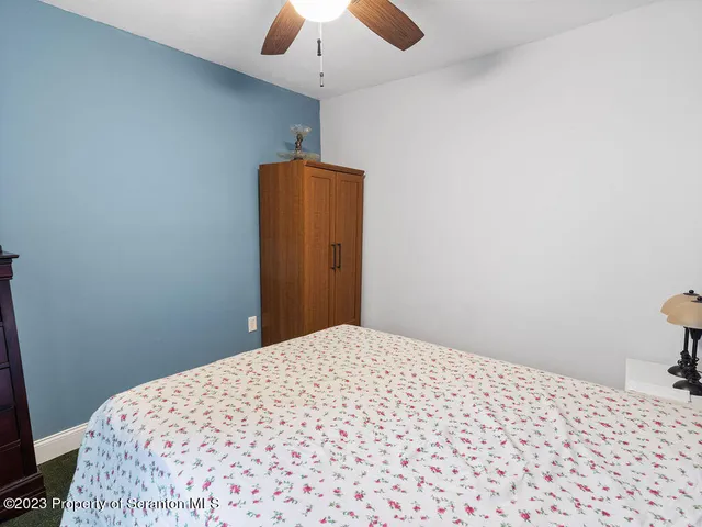 a bathroom with a toilet and a shower curtain