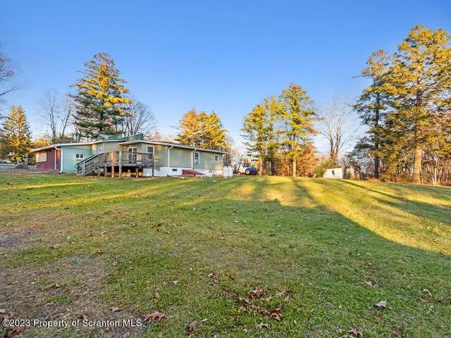 a view of an ocean with a building in the background
