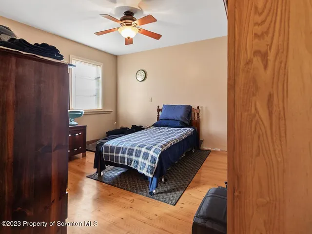 a bathroom with a sink toilet and window