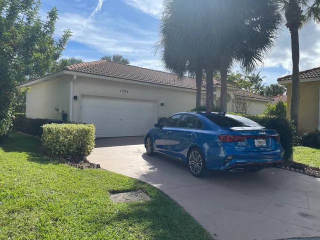 a car parked in front of a house