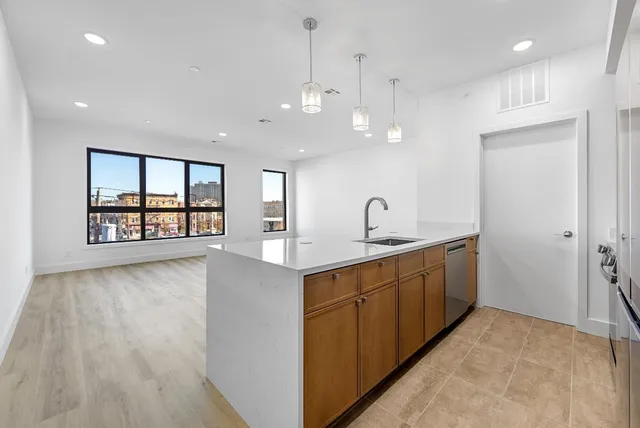 a spacious bathroom with a large tub and sink