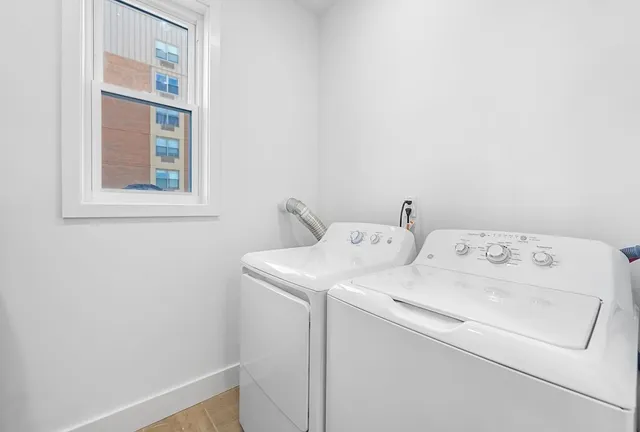 a utility room with dryer and washer