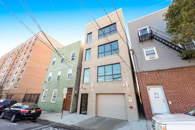 a view of a car park in front of a building