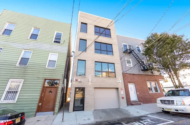 a view of a car park in front of a building