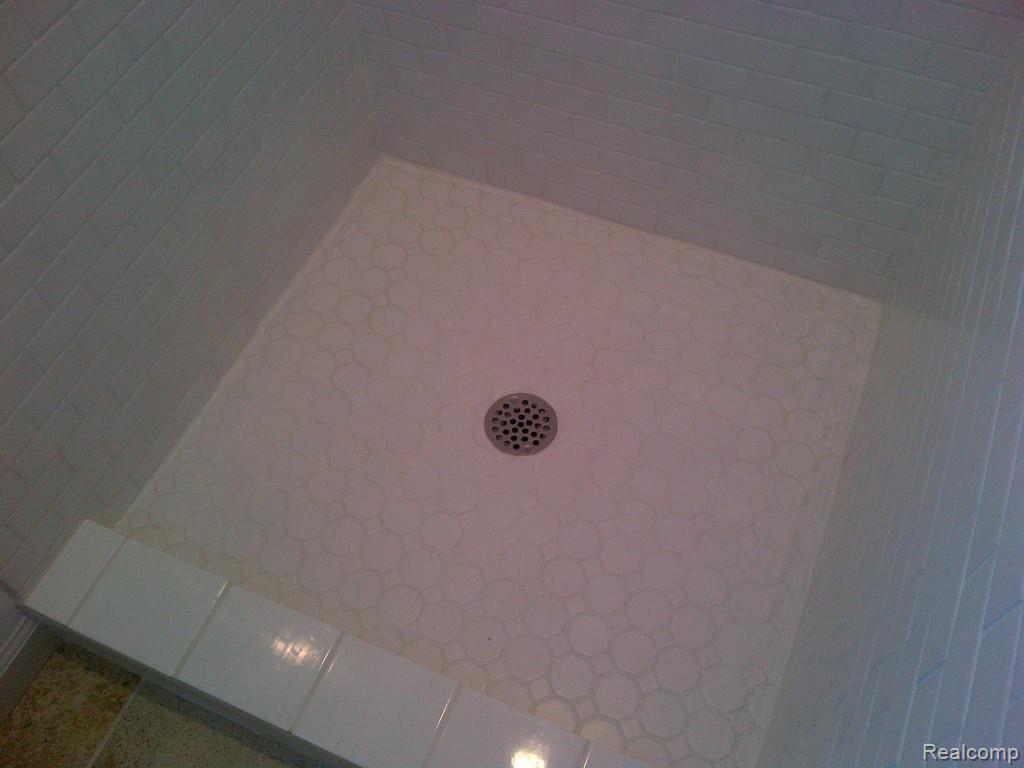3084 Gerald Avenue Rochester, MI 48307 - Photo 29 of 47 master bathroom stall shower tile installed in shower pan.jpg