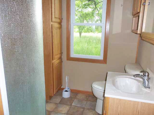 911 Daysville Road Oregon, IL 61061 - Photo 8 of 11 a bathroom with a sink and a toilet