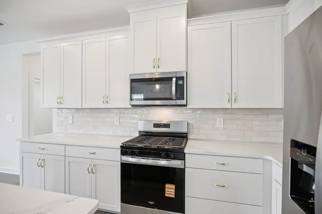 a kitchen with sink cabinets and wooden floor