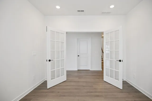 a bathroom with a glass shower door