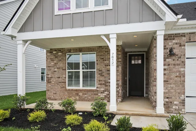 a front view of a house with a garage