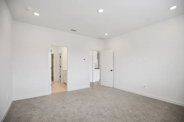 a bathroom with a bathtub and toilet