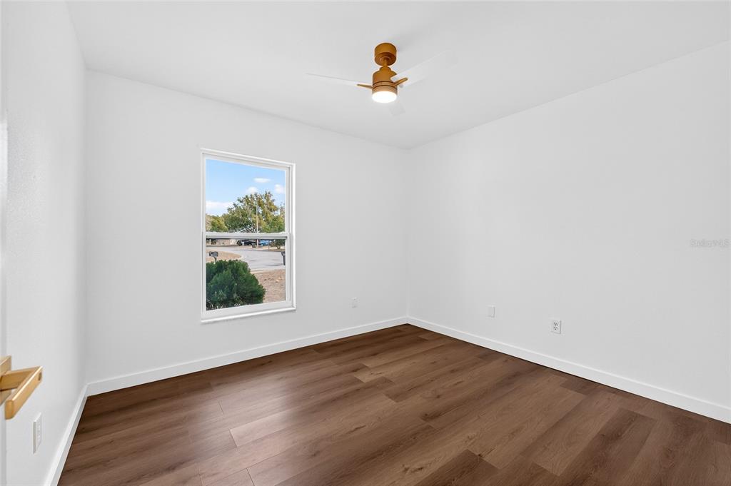 662 Bryan Terrace Drive Brandon, FL 33511 - Photo 18 of 30 an empty room with wooden floor and window