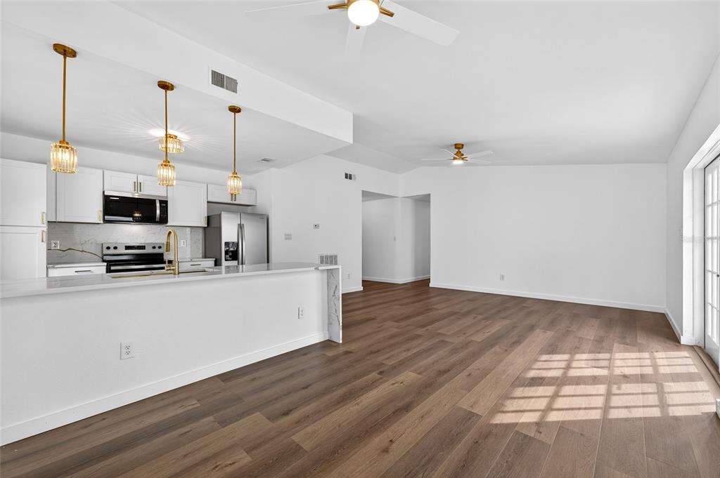 662 Bryan Terrace Drive Brandon, FL 33511 - Photo 6 of 30 a view of a kitchen with microwave and stove